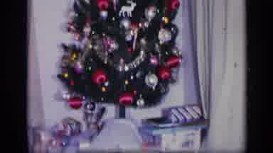 California USA (1969): Woman Wearing Black Dress Watches Television Sitting Under
