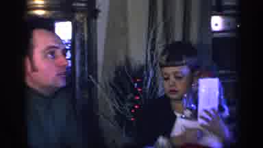California USA-1969: A Little Boy Opening Christmas Gifts With His Father
