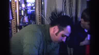 California USA (1969): Family Unwrapping Christmas Gifts Showing Man With Whoopee