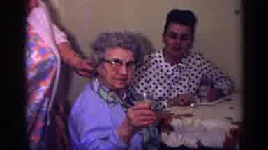 California USA (1969): Lovely Family Gathering To Celebrate Older Woman's Birthday