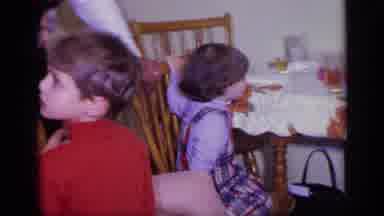 California USA (1969): Little Boy Cannot Focus On Whether To Look At Table Or