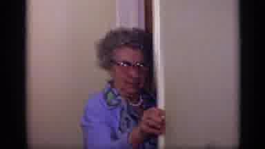 California USA (1969): Old Lady Stands At The Door And Get Kissed By Young Women