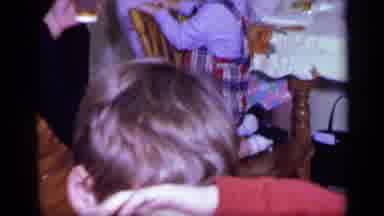 California USA (1969): Two Children And Adults Moving Around A Table Very Busily