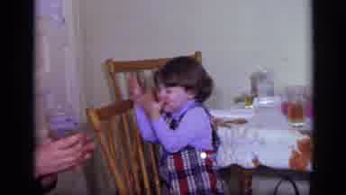 California USA (1969): Mother And Grandmother Put Shy Toddler On Spot To Perform