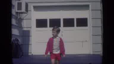 California USA-1969: Young Boy Watches Marching Band Parade Pass By