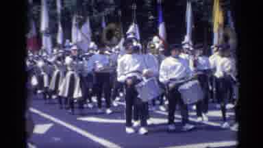 California USA (1969): Band Directors March Alongside A Marching Band That Marches
