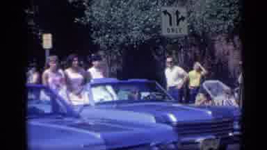 California USA (1969): A Nice Day For A Parade With Woman Riding In Cars And A