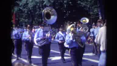 California USA (1969): Marching Band Comes Forward Then Man Steps Out Of The Way