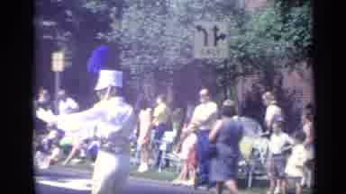 California USA (1969): Man Wearing White Shirt Leads Marching Band Wearing Blue
