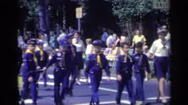 California USA (1969): Boy Scouts On A Parade While Pulling Their Attractions On