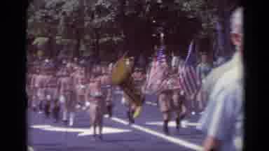 California USA (1969): People Holding Flags Marching Down A Road