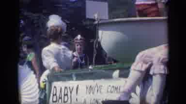 California USA (1969): A Flower Decorated Float Full Of Different Aged Women