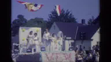 California USA (1969): A Parade Rolls Down The Streets As A Marching Band Plays