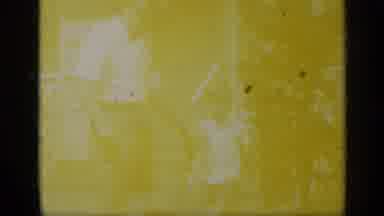 California USA (1969): Man Wearing White Shirt Walks With Toddler On A Bright
