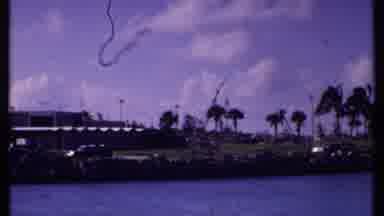 Bahamas (1969): View From A Boat On The Water Of Palm Trees Water And Cars Driving