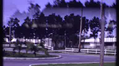 Bahamas (1969): Yellow Bungalows And Green Trees On A Sunny Day