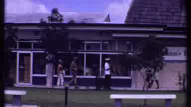 Bahamas (1969): Man Helping Two Other People Get To Where They Need To Go