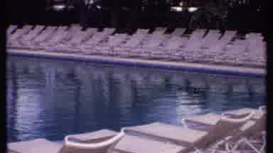 Bahamas (1969): A Beach With Lots Of Beach Chairs And A Pool With Lots Of Poolside