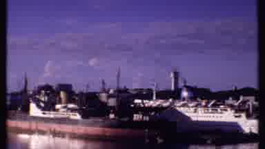 Bahamas (1969): Loading Dock In European Country With Factories In The Background