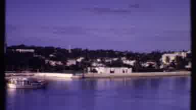 Bahamas (1969): Panoramic Of Shoreline Under Blue Skies Near Homes And Churches