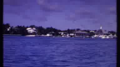 Bahamas (1969): Scenic Buildings And Houses Along A Shoreline Filmed From A Moving