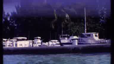 Bahamas (1969): Boats Docked On The Side Of The Trees And Mostly Colored White