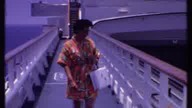 Bahamas (1969): Woman With Black Hair And White Handbag Is Descending From Big