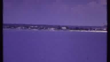 Bahamas (1969): Camera Pans From Left To Right Over Beach And Buildings On The