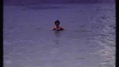Bahamas (1969): Woman Wearing A Black Bathing Suit Bobbing Up And Down In The Calm