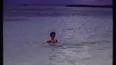 Bahamas (1969): Brown Hair Woman Swimming Happily All Alone In Clean Blue Sea
