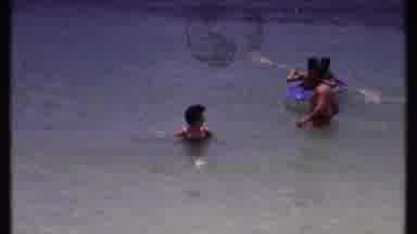 Bahamas (1969): Three Adults Walking In Chest Deep Water As Two Young Children