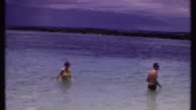 Bahamas (1969): People Swimming And Talking Near Shore From Ocean