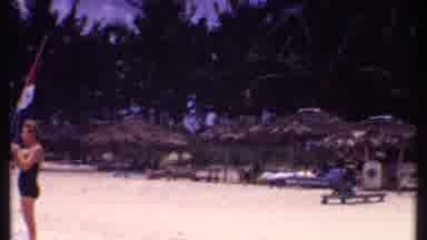 Bahamas (1969): People At The Beach With Beach Huts