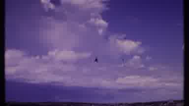 Bahamas (1969): Helicopter Flies Overhead As People Cross The Street