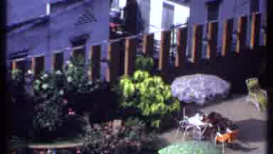 India (1969): People Sitting In Orange Outdoor Furniture By Pool On A Clear Sunny