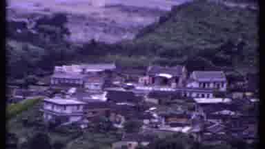 India (1969): Small Village Nestled Between Misty Mountains With A Plant Leaf In