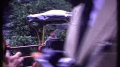 India (1969): Man Pushes A Street Cart Then A Street Cart Drives On The Road