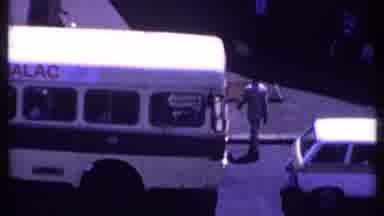 Kenya (1969): Man In White Suit Crosses Street Between Vehicles Then Continues