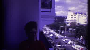 Kenya (1969): Women With Beehive Haircut And Glasses On A Balcony Panning To