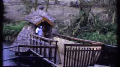 Kenya (1969): Man Standing In A Gazebo Then A Low Angle A Monkey Climbing A Tree