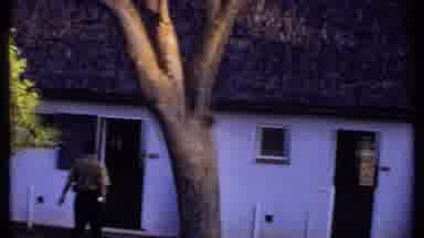 Kenya (1969): Man Inspects The Grounds As Another Man Inspects The Roof