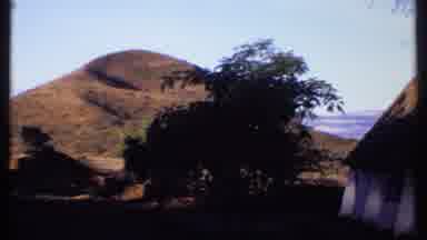 Kenya (1969): Mountain In The Distance With Trees In Front Of It