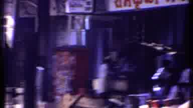 Kenya (1969): Really Crowded City With People Next To Veggies Cart And A Sculpture