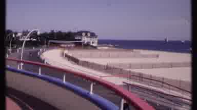 New London Connecticut-1969: A Railing With Overhanging Lights Overlooks A Boardwalk And Ocean