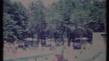 California USA (1971): A Lady Getting Up From Swimming Pool