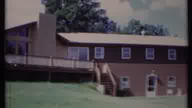 California USA (1971): Planning Shot Of A Large House Including A Tree
