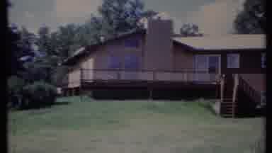 California USA (1971): A Farmland With A Simplistic And Small Home With A Green