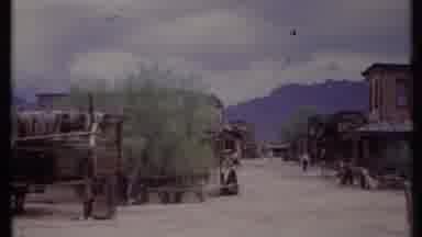 California USA (1971): Old West Town With Barns Shops And People Wandering The