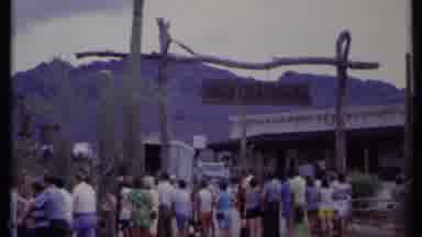 California USA (1971): People Standing Around In The Desert With A Western Themed