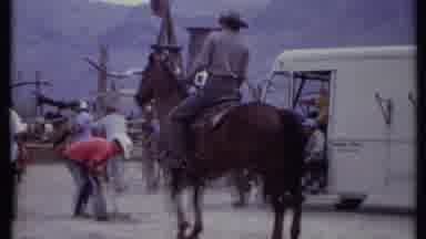 California USA (1971): A Large Group Of People Looking At A Man In A Cowboy Hat On